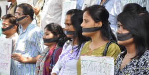 Journalist tie their mouth with black cloth and hold placards while staging a silent protest against the attacks attacks on Journalist in Assam as well in the country , in front of Guwahati Press Club on Monday. The Journalist also demanding for security law for the Journalist working in the state.